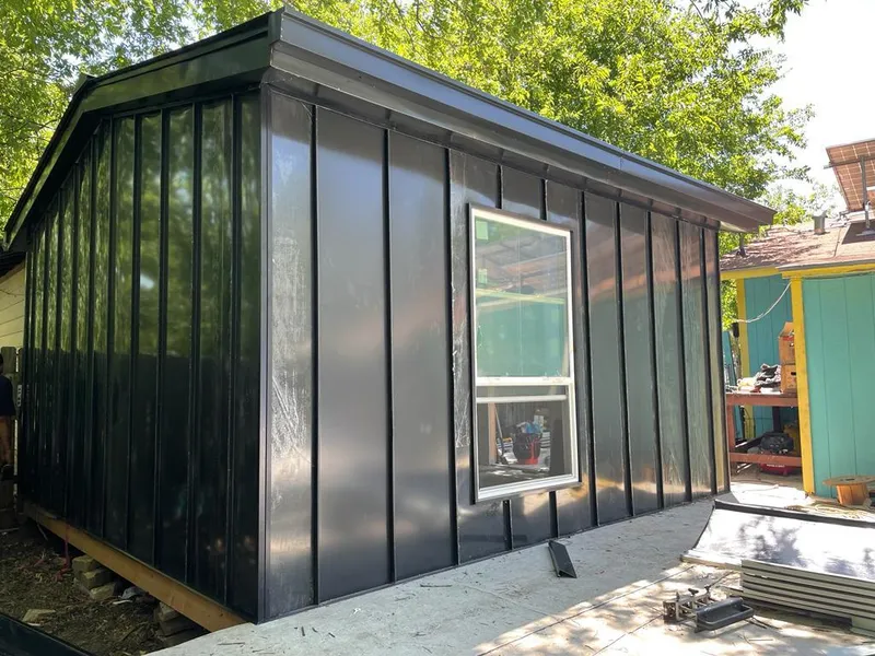 Black standing seam metal wall panels for Roof Inspection in Oxford